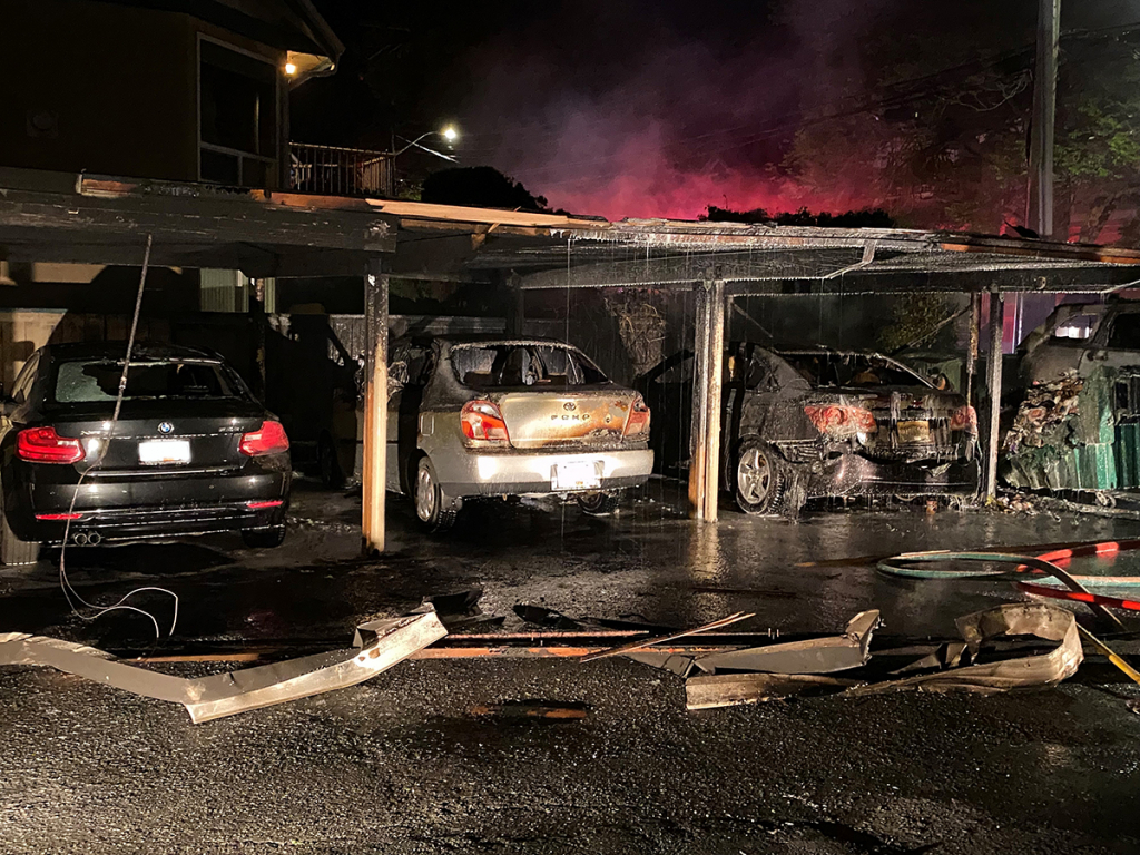 Vehicles and structure damaged in arson.